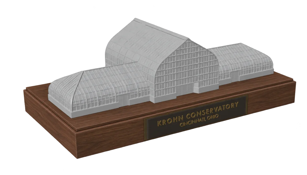 Krohn Conservatory glasshouse model on a wooden display base with a brass nameplate